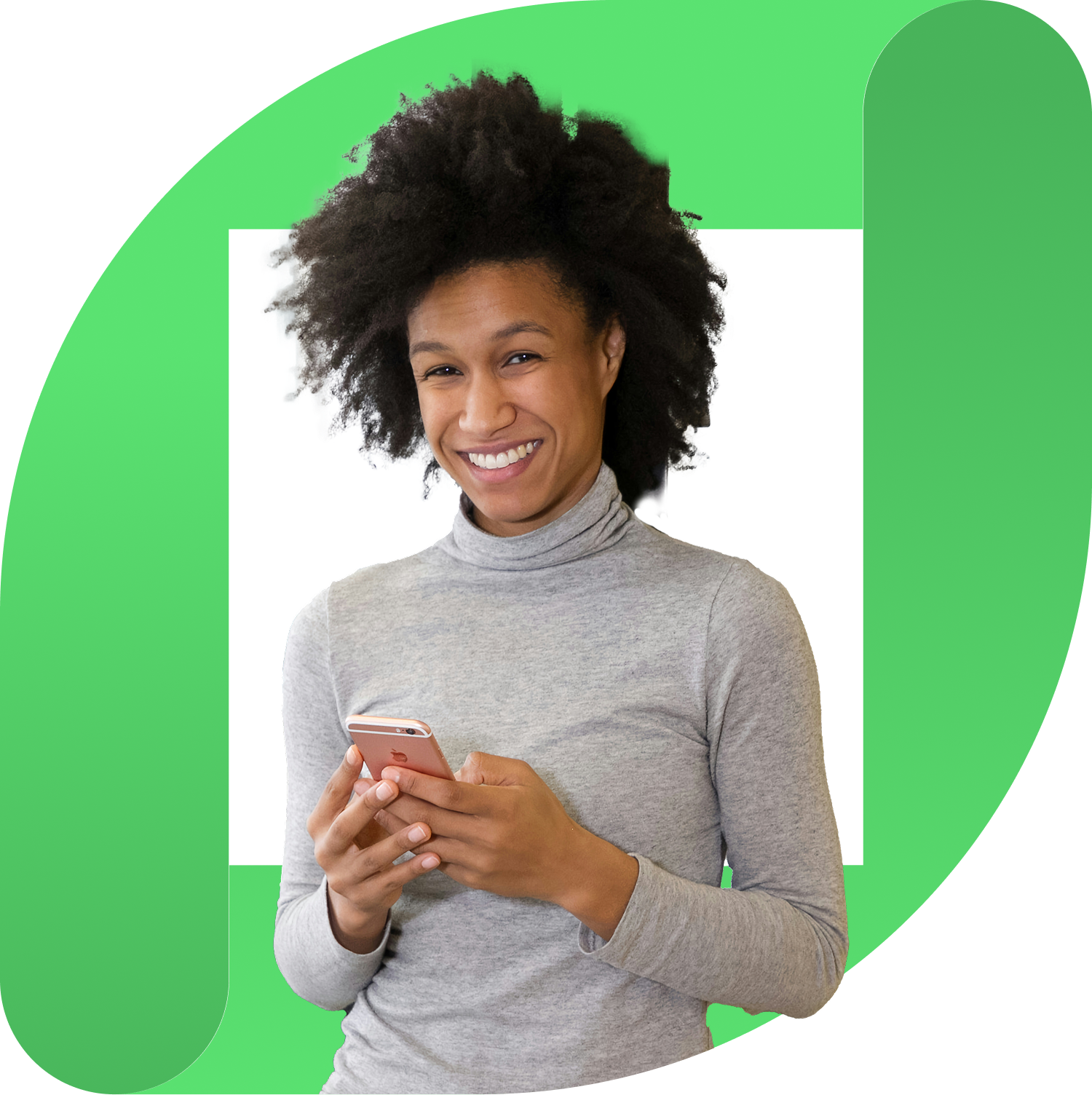 Smiling woman with curly hair wearing a gray turtleneck holding a rose gold smartphone in front of a green abstract shape.